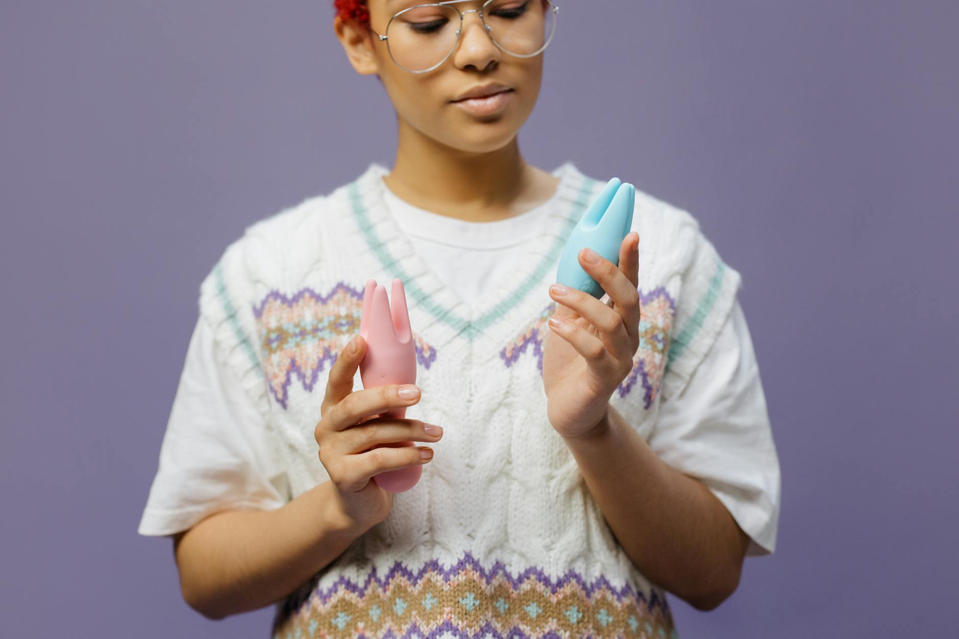 Woman holding a blue lemon clitoral vibrator, exploring options for pleasure with diabetes-related sensation changes.